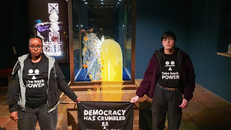 4 arrested after protesters throw crumble at Britain’s Crown Jewels